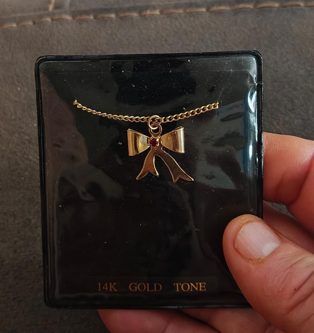 1980s 14k Gold Tone Bow Pendant Necklace With Vibrant Red Stone