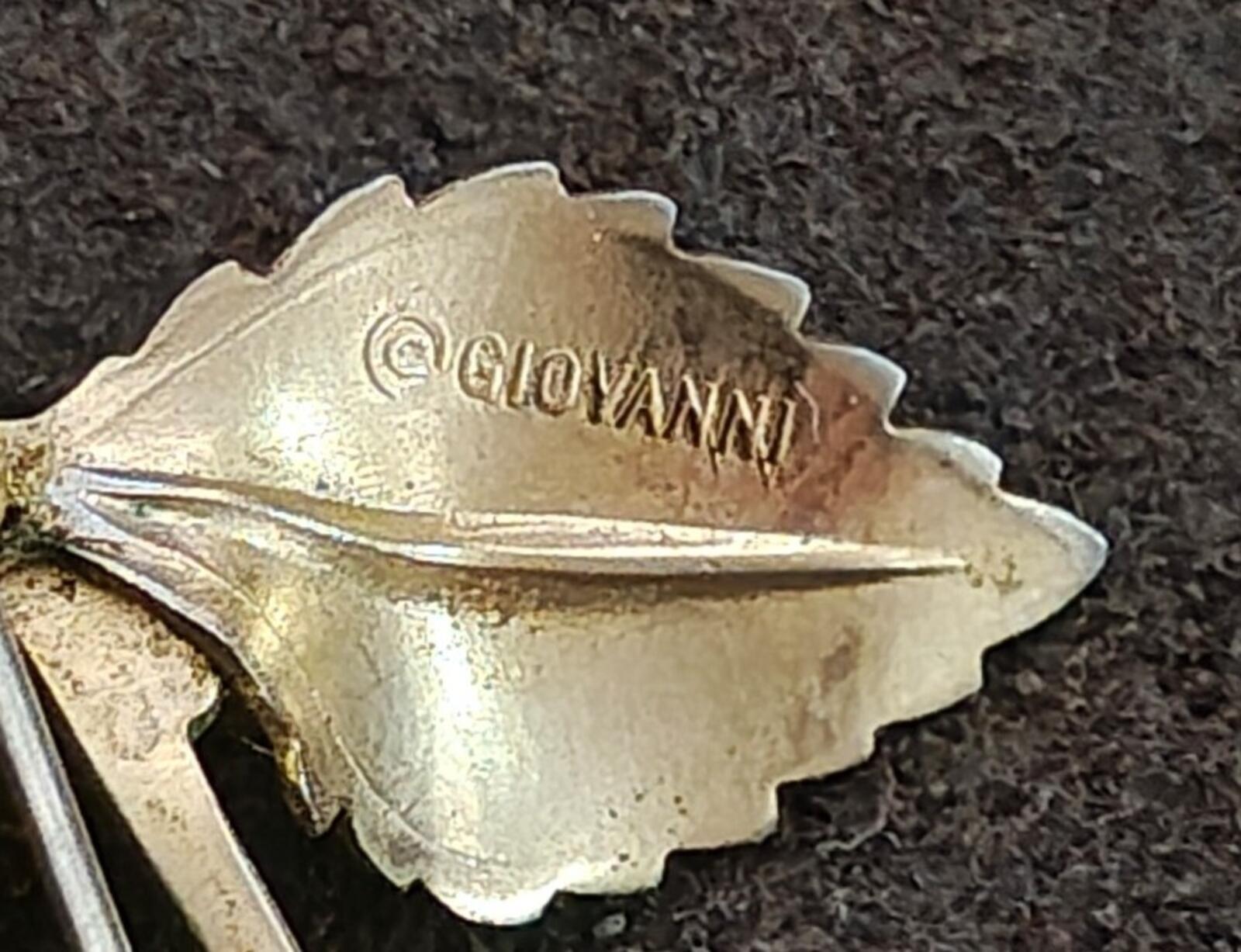 Signed Giovanni gold tone brooch back, close-up of engraved maker text