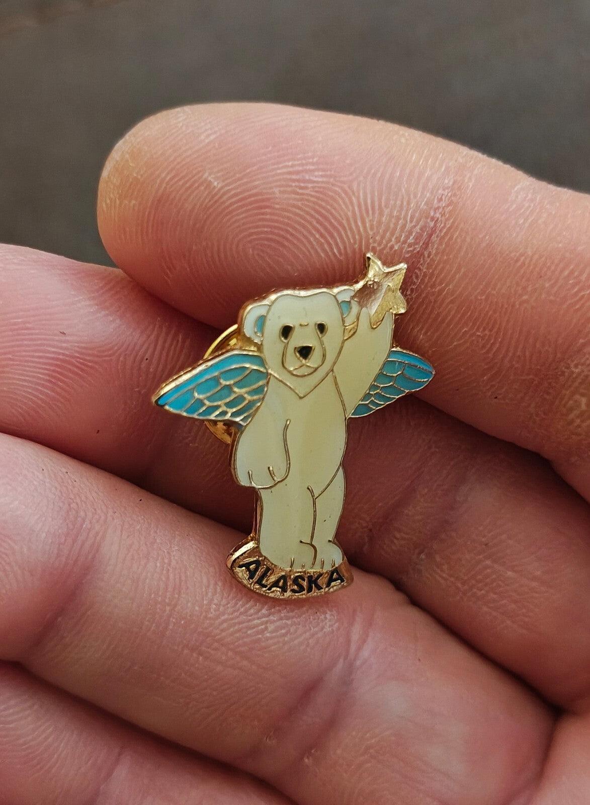 1980s Alaskan Polar Bear Guardian Angel Gold Tone Enamel Pin.