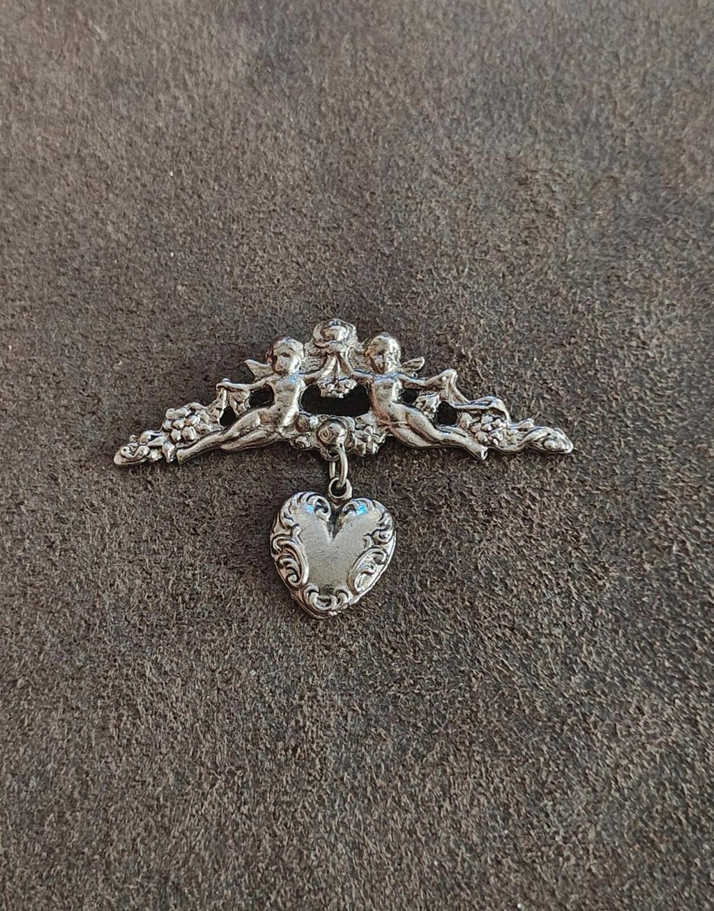 1980s Silver Tone Renaissance Style Cherub Brooch With Dangling Heart Charm