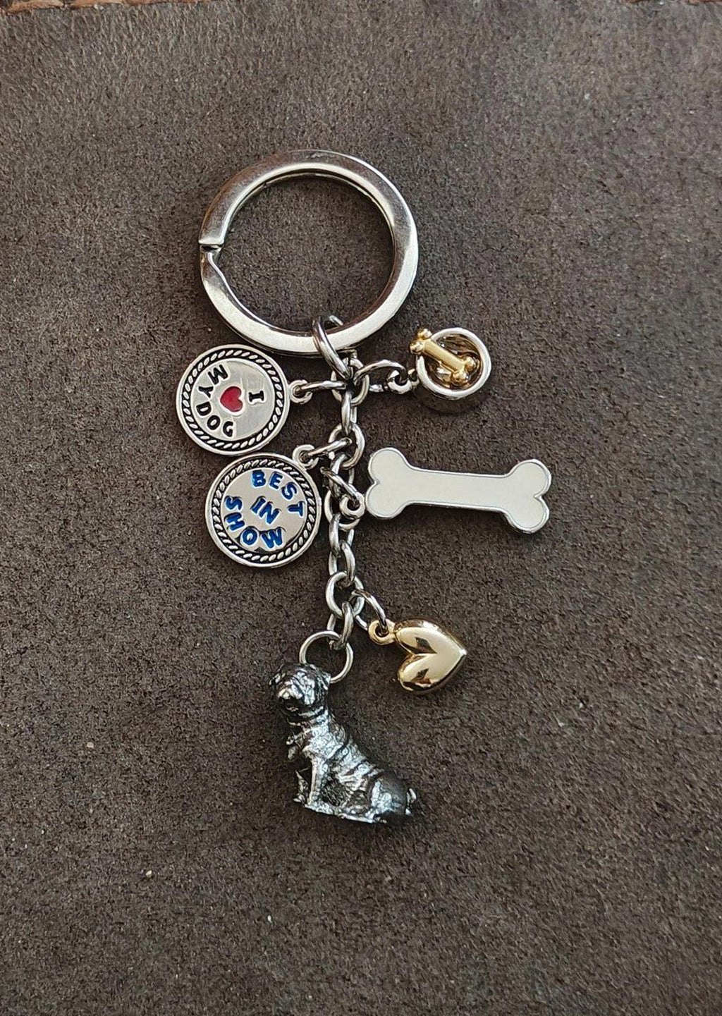 Dog-themed keyring charm set with dog figure, white bone charm, heart charm, and dog badges