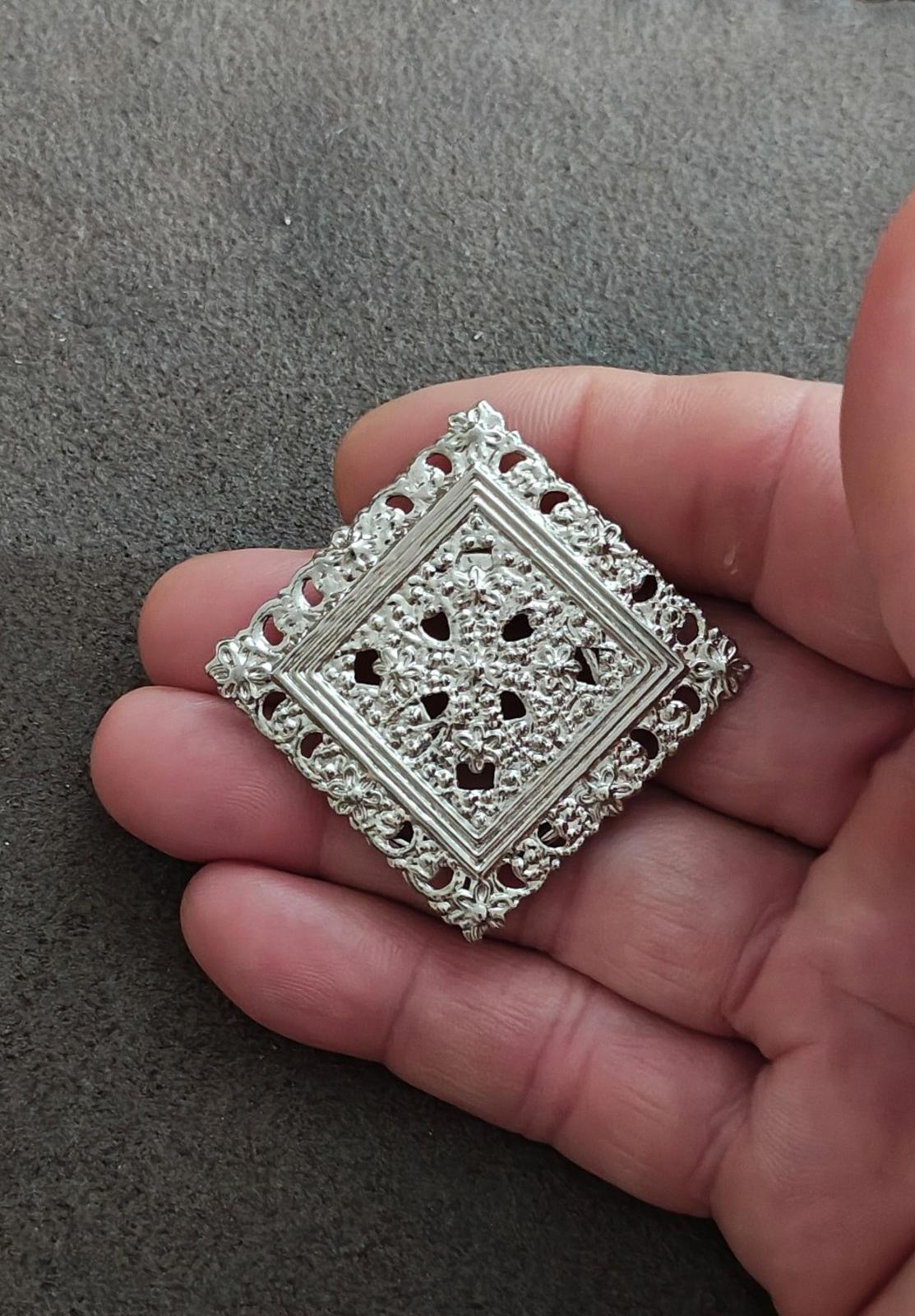 Silver-tone square filigree scarf clip with openwork center and decorative frame