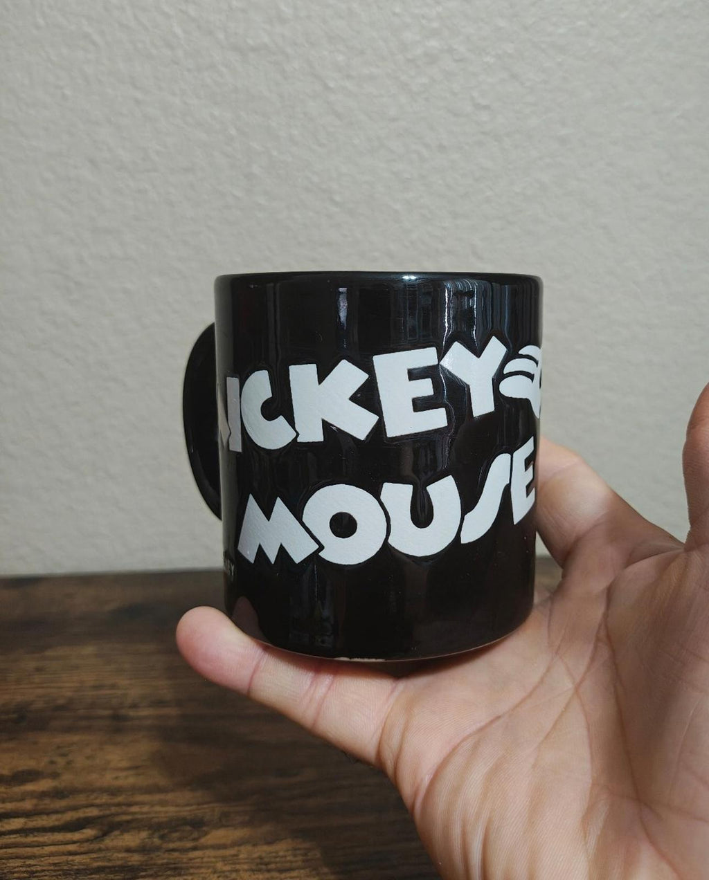 Black mug with white “MICKEY” and “MOUSE” text graphic