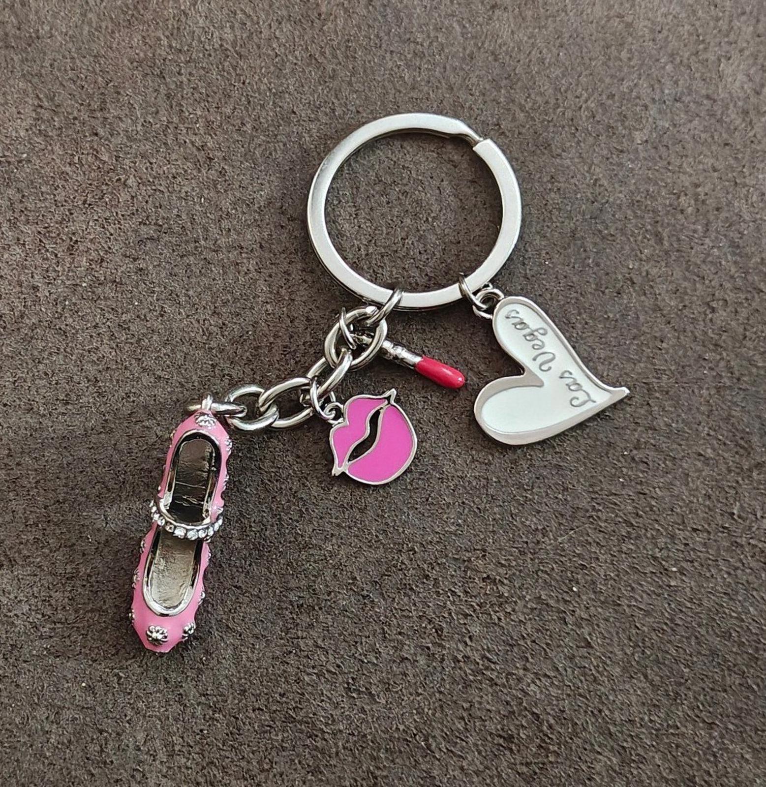 Pink high heel keychain with lipstick, lips, heart, and Las Vegas tag on silver ring