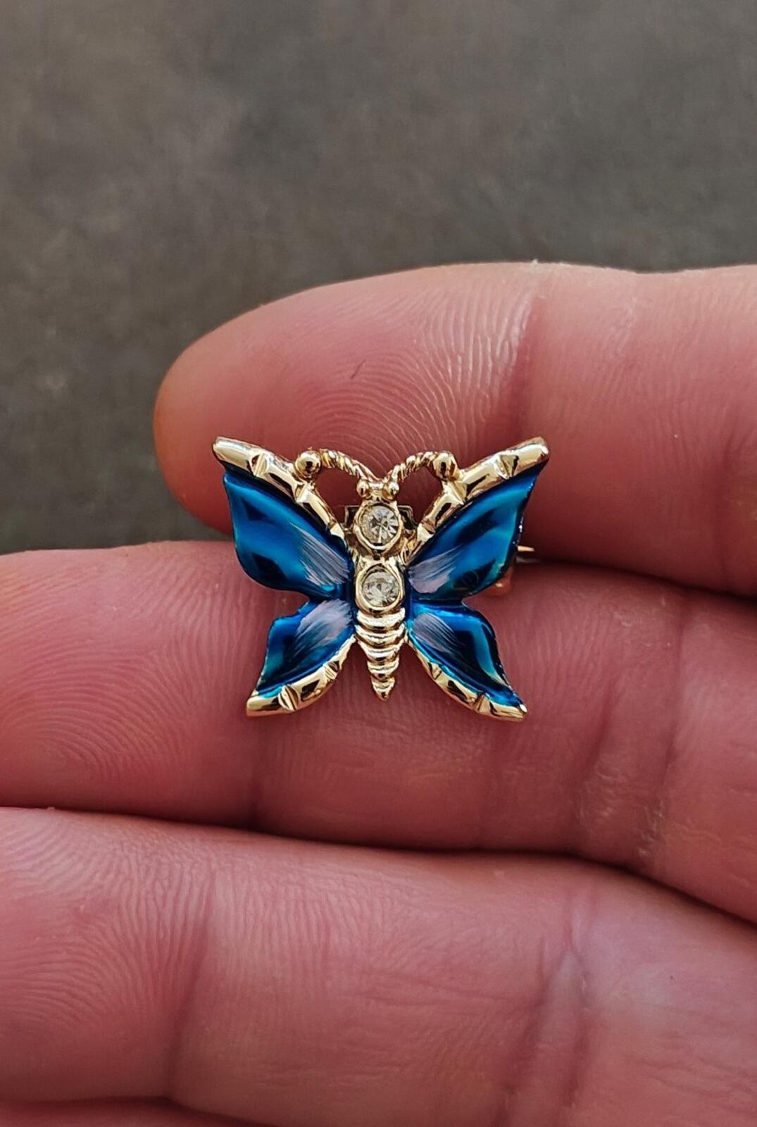 1980s Gold Tone Blue Enamel Butterfly Brooch Accented With Clear Rhinestones