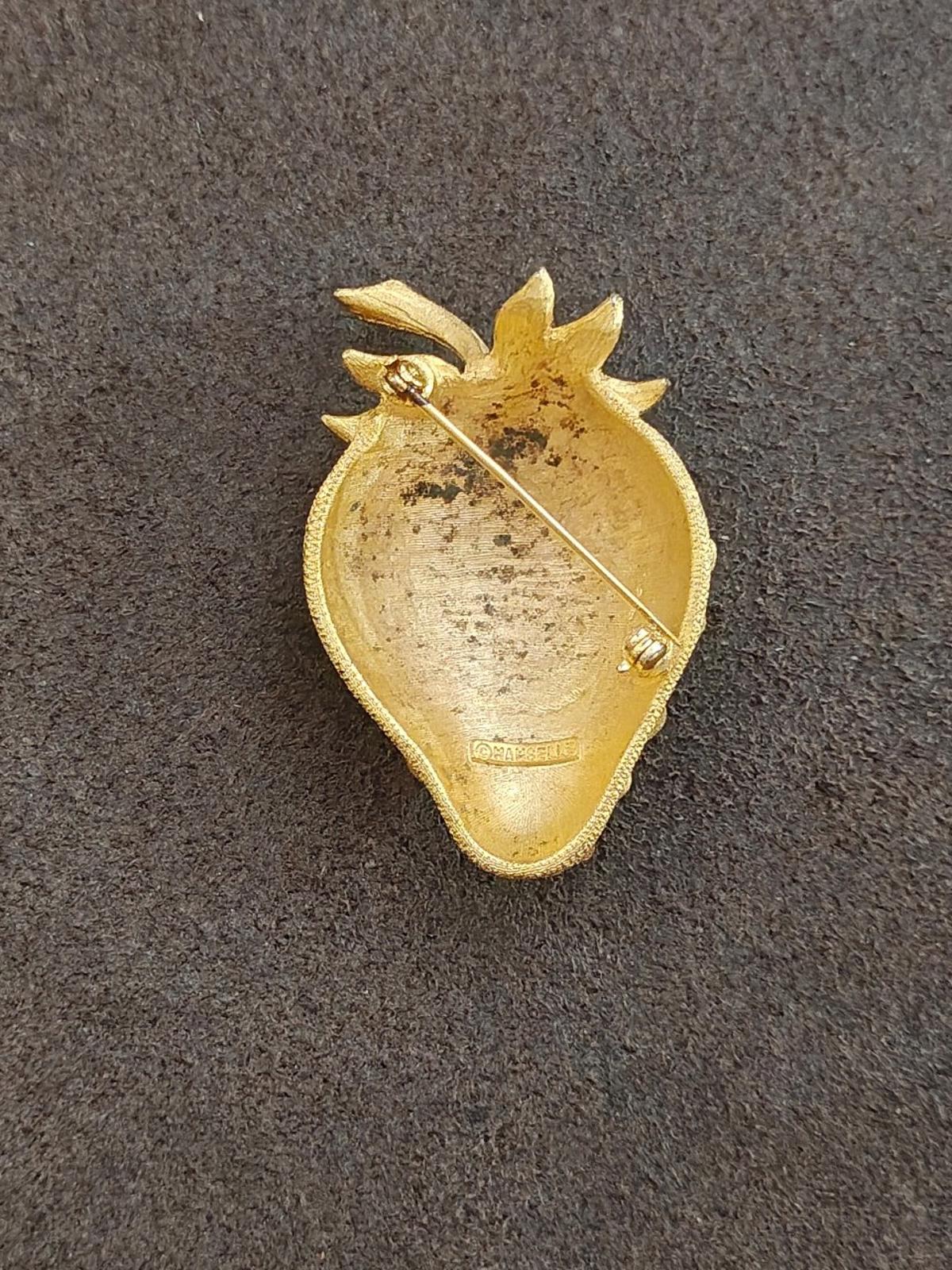 Gold tone strawberry brooch pin back with safety clasp and pin post.