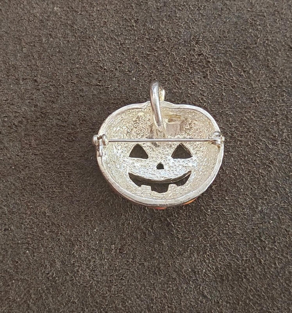 Silver-tone jack-o'-lantern pumpkin brooch back with pin and clasp