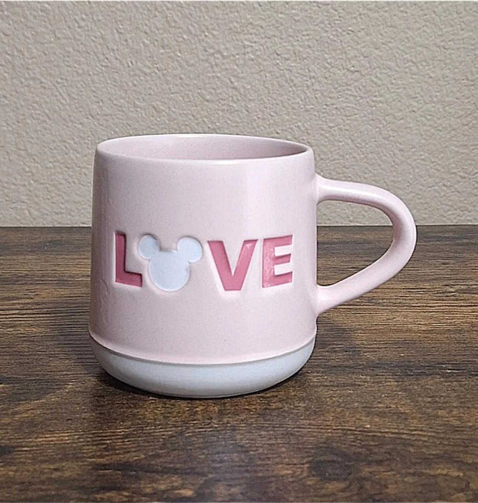 Pink stoneware mug featuring LOVE lettering and heart mouse graphic on side