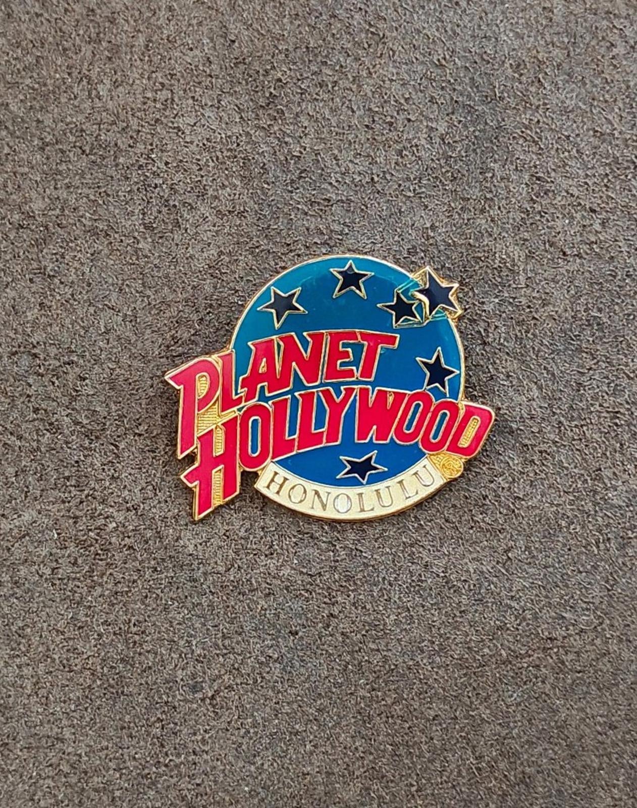 Round Planet Hollywood Honolulu enamel pin, blue field with stars and red logo