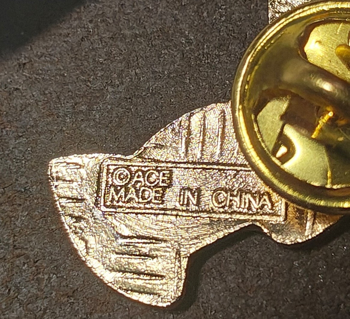 1980s Alaskan Polar Bear Guardian Angel Gold Tone Enamel Pin.