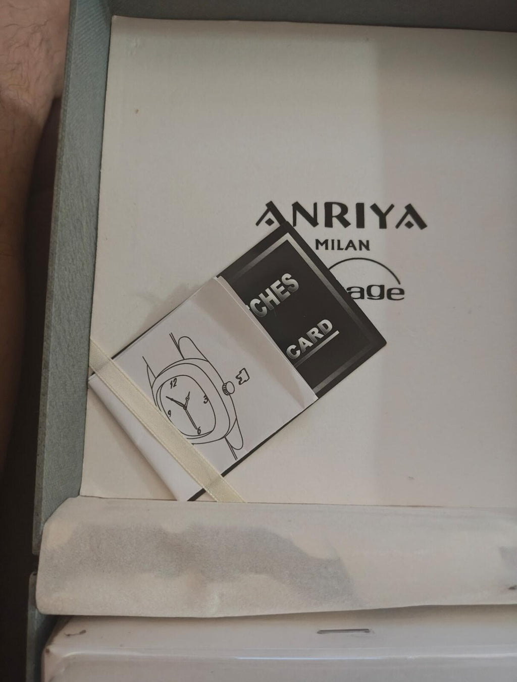 Black cardholder with “card cases” label and matching box insert in set.