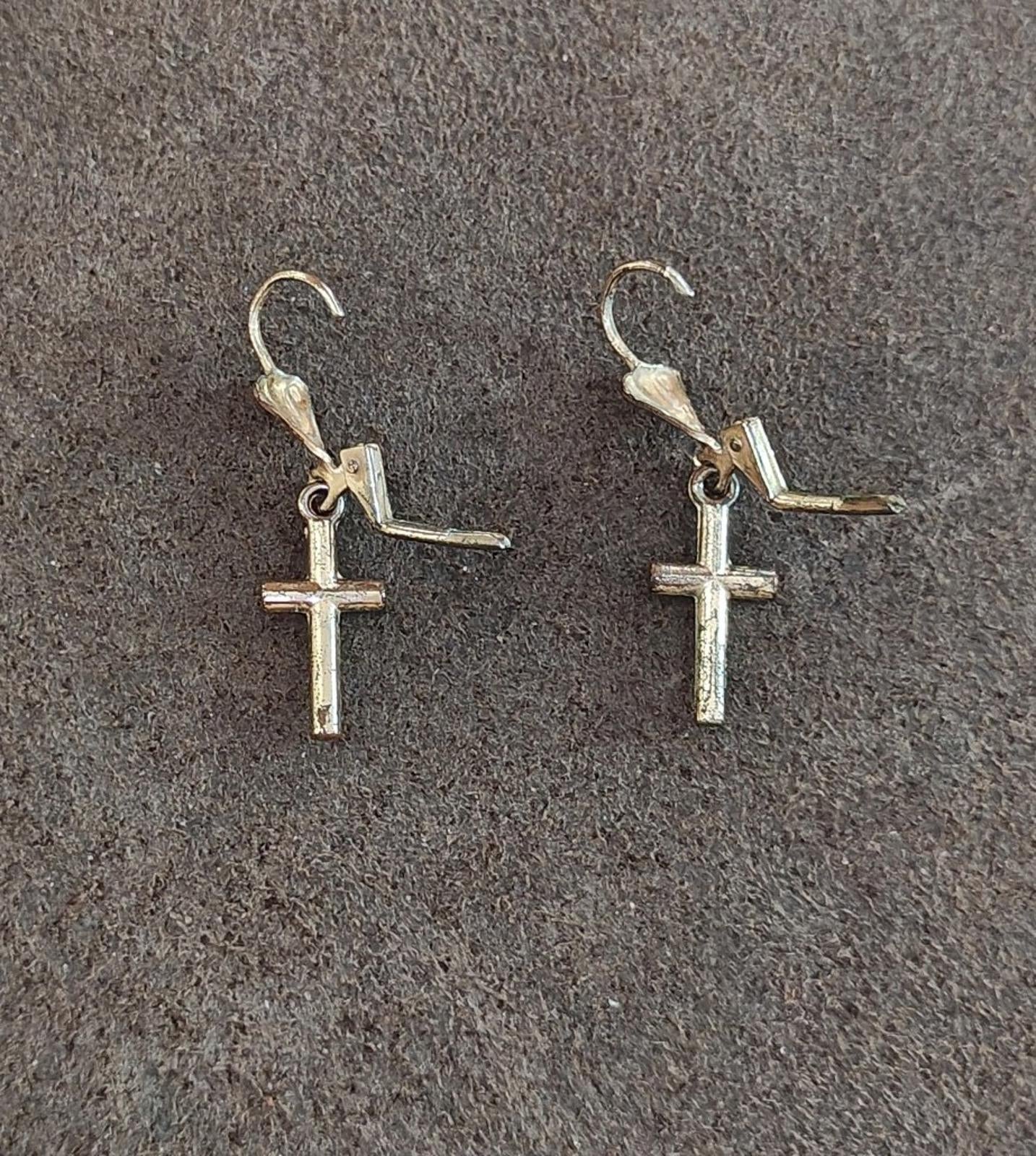 Silver-tone cross drop earrings with heart top charms and side bar hooks.