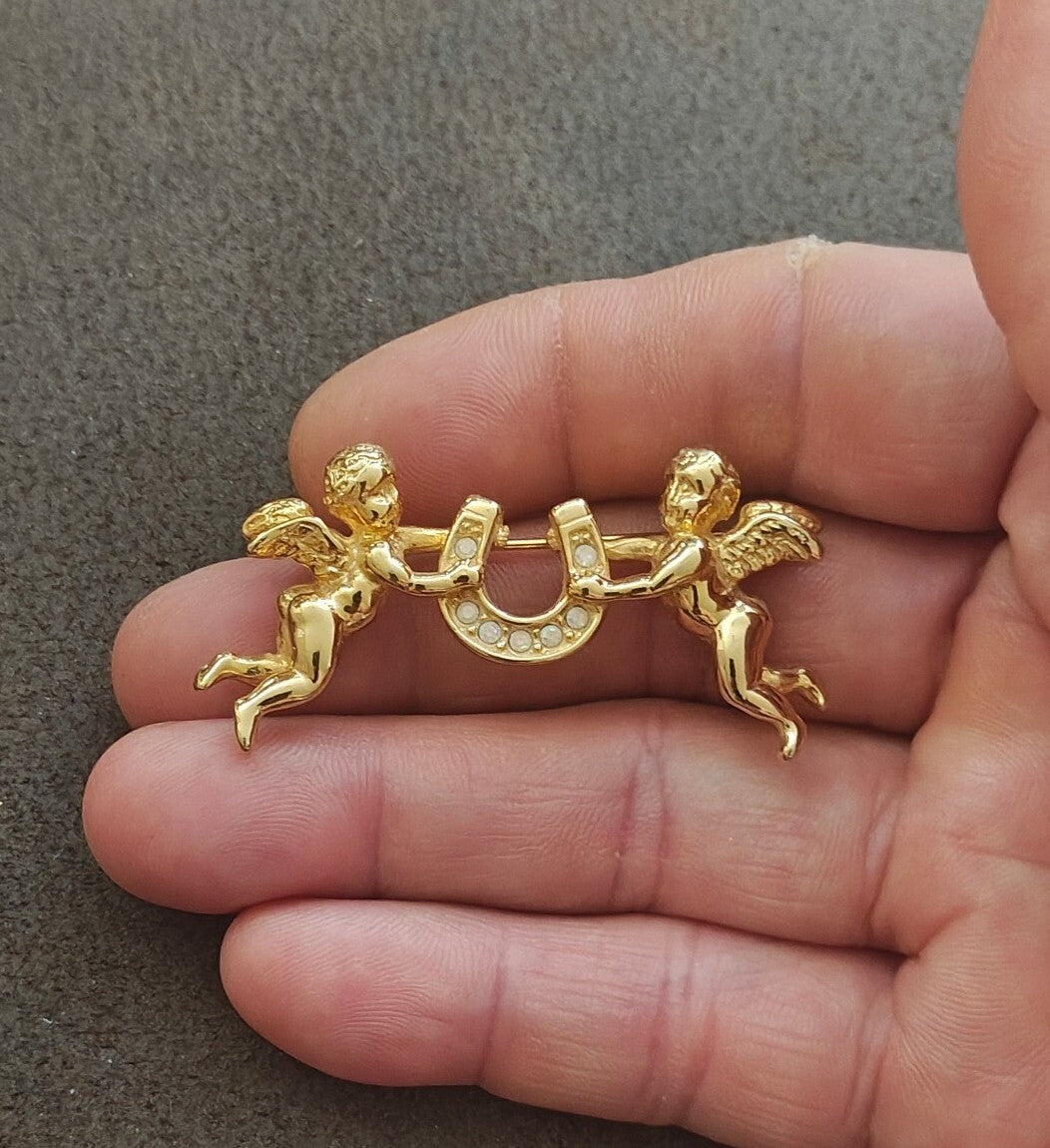 1980s Unsigned Kirks Folly Gold Tone Cherub & Lucky Horseshoe Brooch Pin