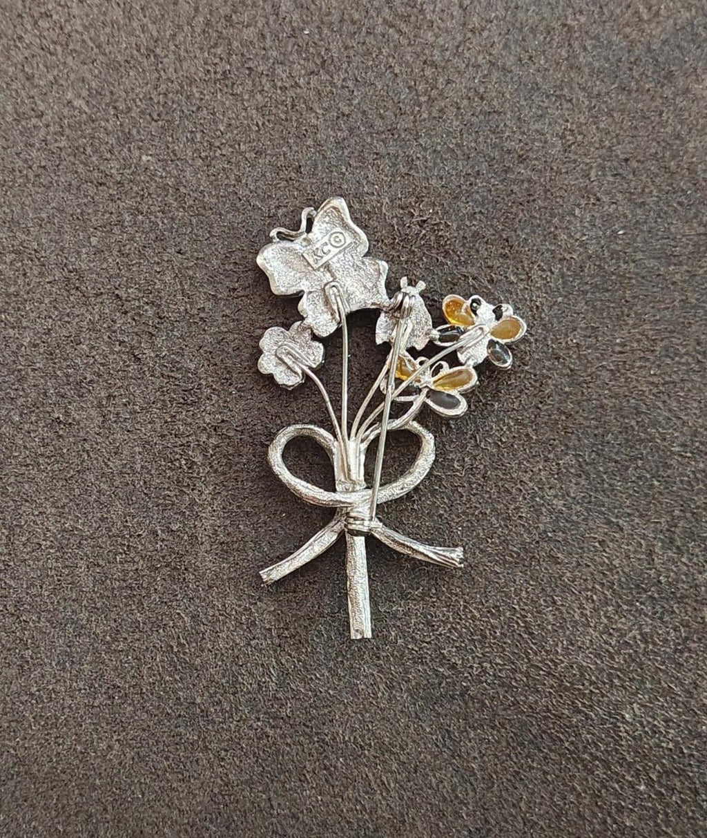 Silver-tone bouquet brooch back view with pin and ribbon knot