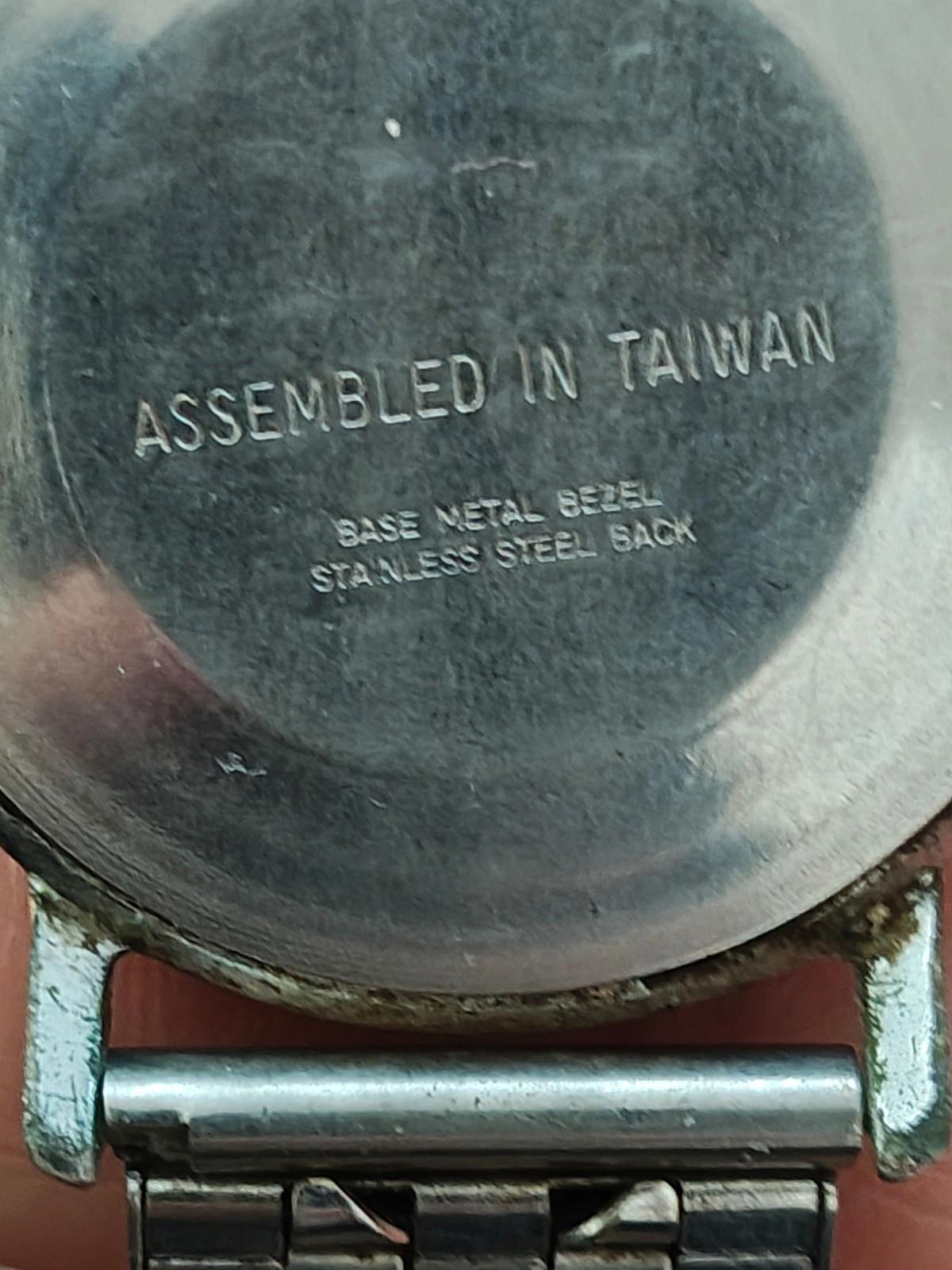 Timex Mercury case back close-up showing “ASSEMBLED IN TAIWAN” and metal base info