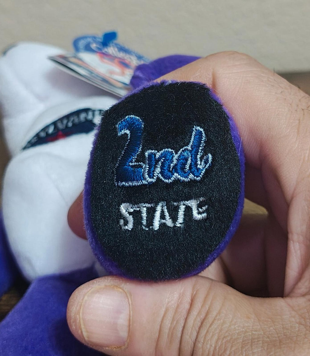 Close-up of black fabric tag reading “2nd” and “STATE”
