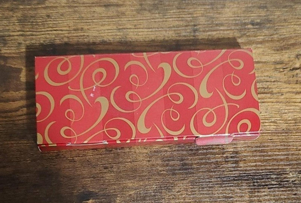 Red patterned gift box for set of three bisque porcelain ornaments