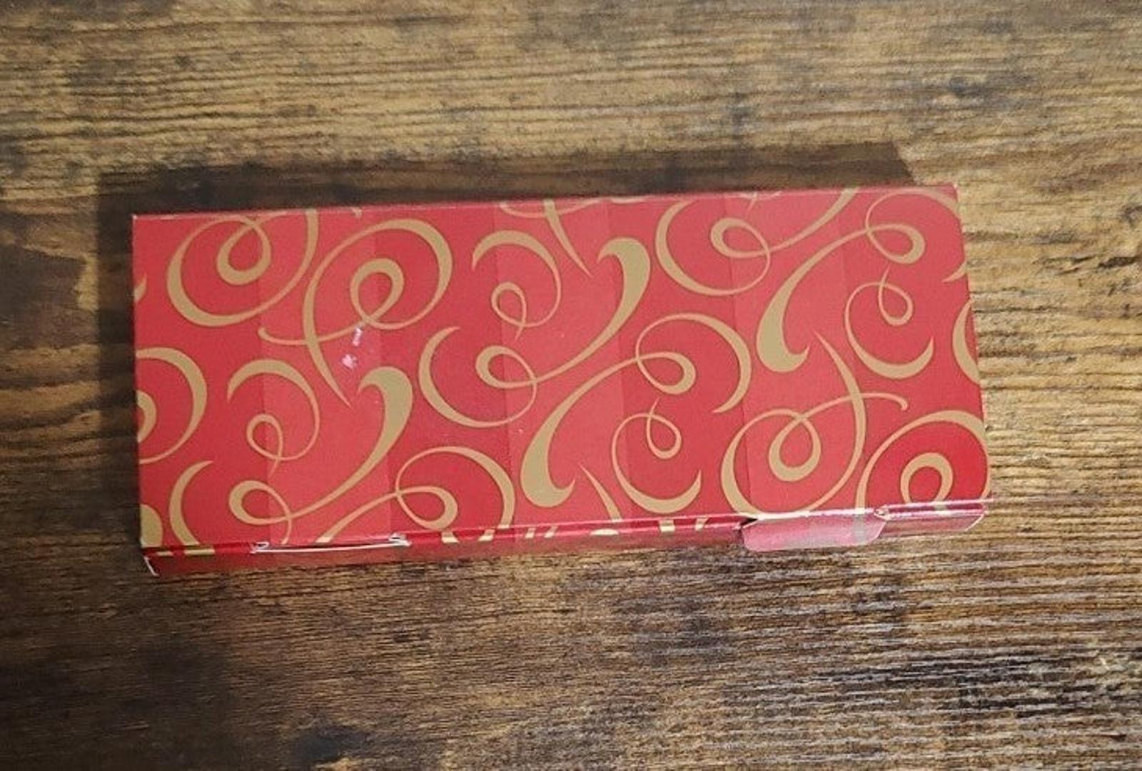 Red patterned gift box for set of three bisque porcelain ornaments