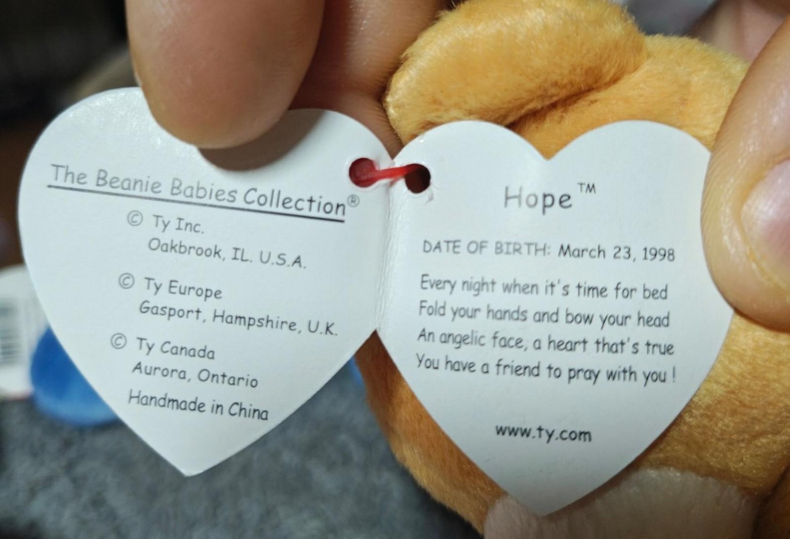 Ty heart tag showing “Hope” and birth text on brown plush bear