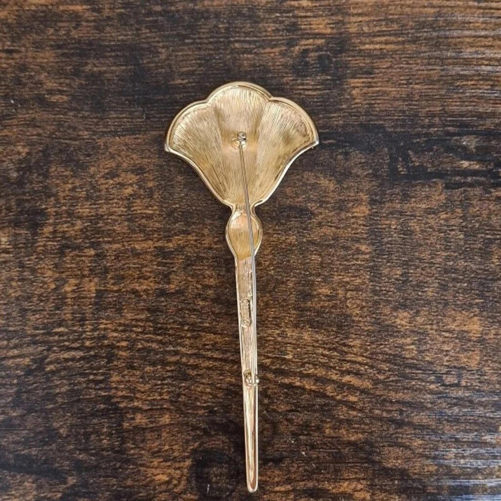 Gold enamel flower pin brooch back view with pin post and small fastening clasp