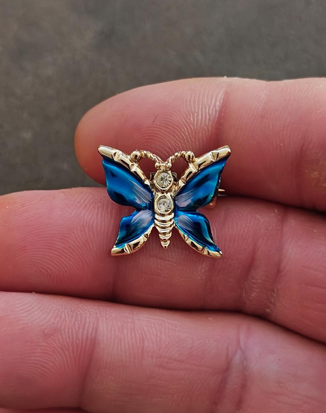 1980s Gold Tone Blue Enamel Butterfly Brooch Accented With Clear Rhinestones