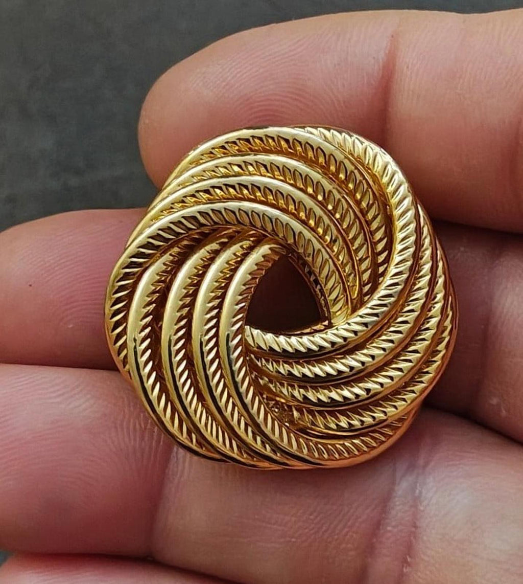 Gold tone swirl rope brooch pin with circular modernist spiral cutout