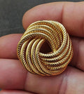 Gold tone swirl rope brooch pin with circular modernist spiral cutout