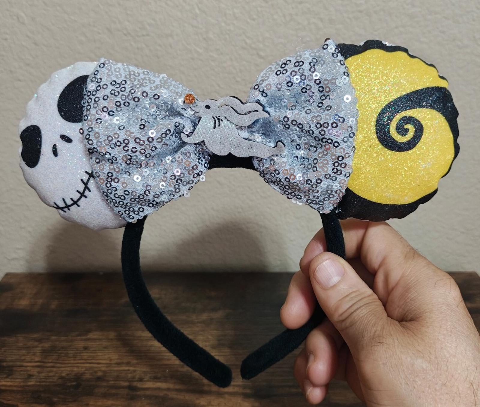 Silver sequin bow headband with black ears, skull face patch