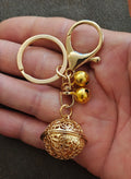 Gold Tone Filigree Chime Ball Keychain