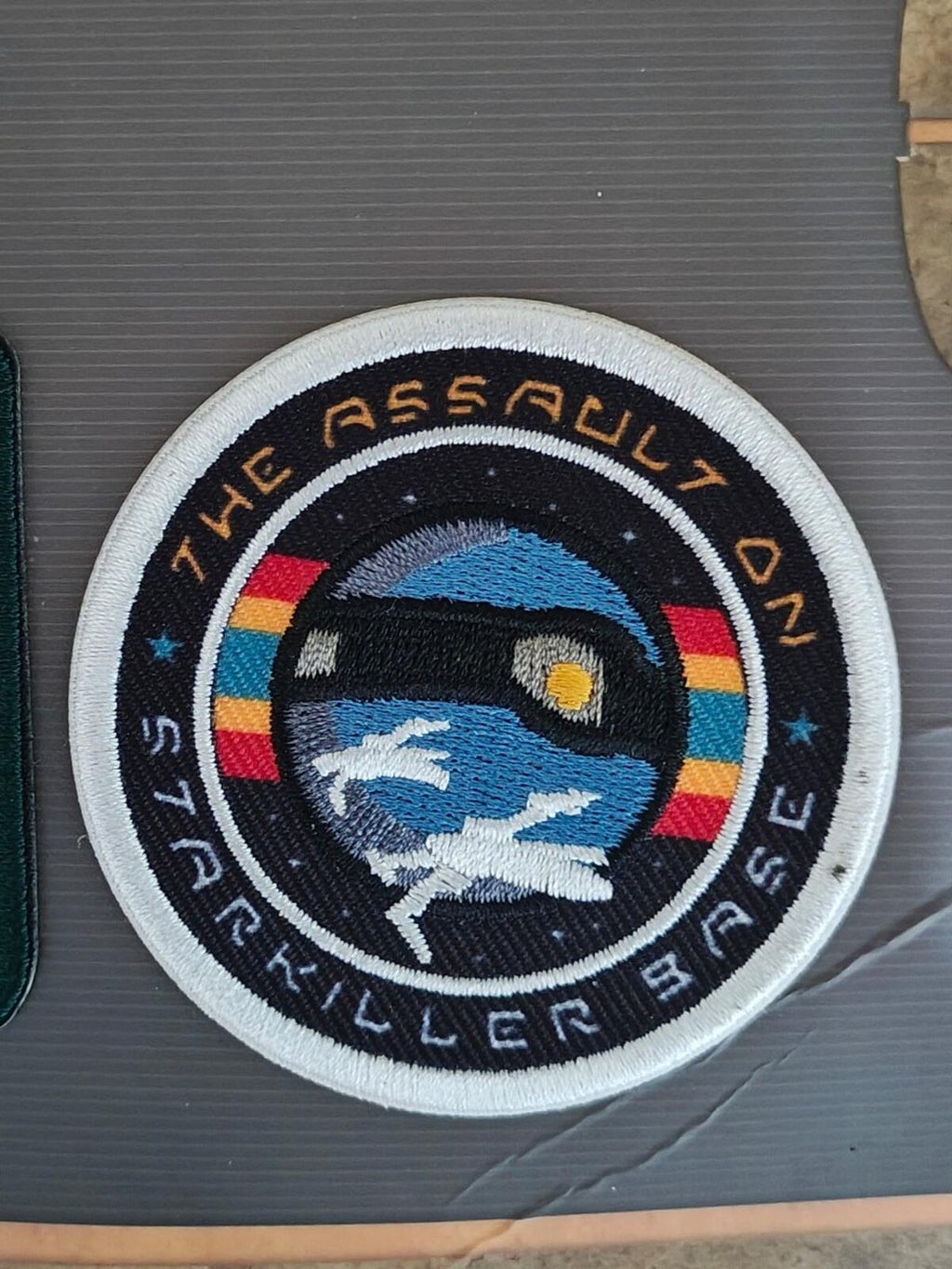 Embroidered round assault crackerblers patch with blue droid and multicolor band