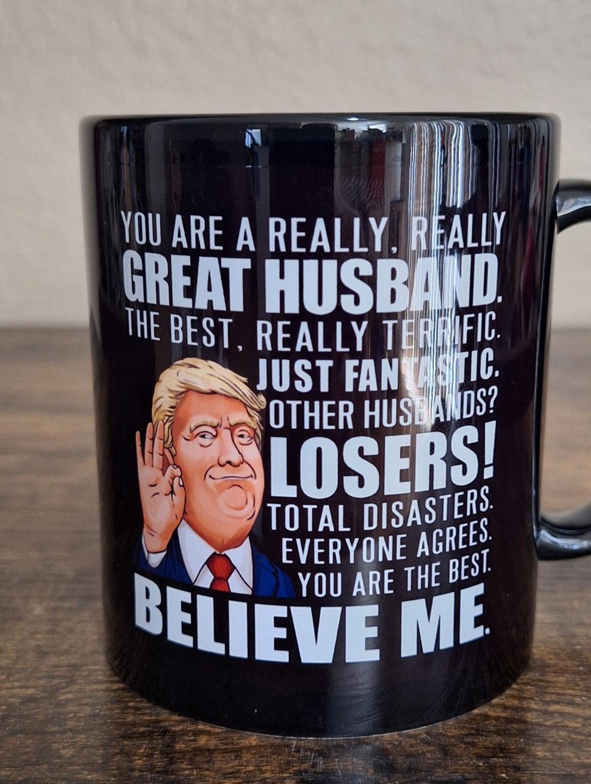 Black ceramic 11 oz mug close view, featuring "Great Husband" and "Believe Me"