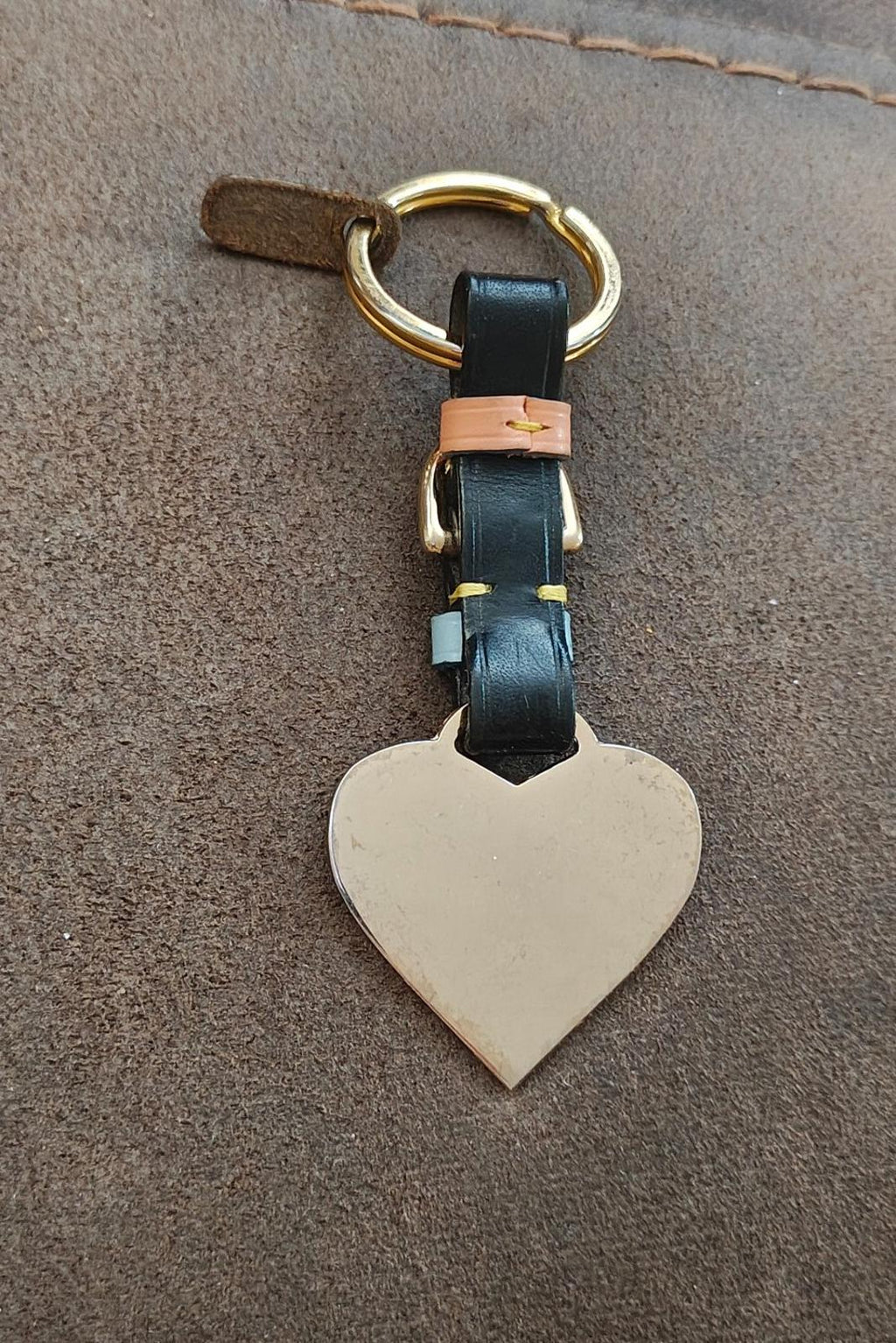 Heart keychain fob with gold ring, black leather strap, light blue band, blank white heart tag