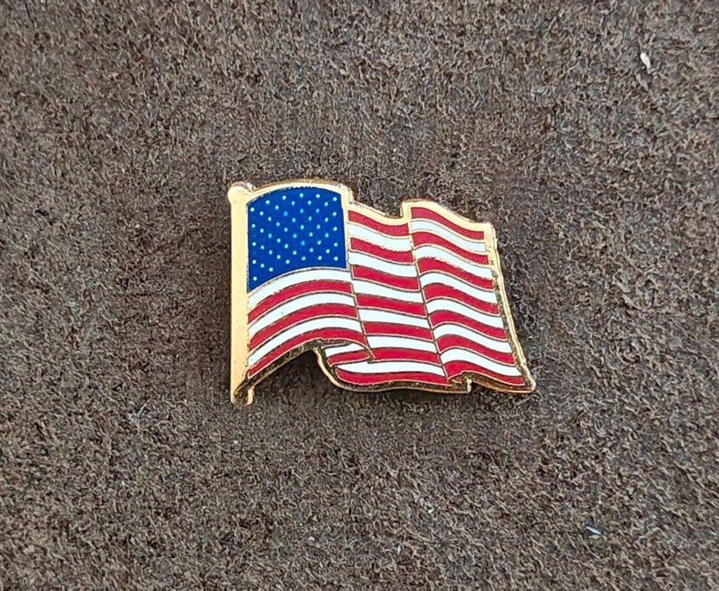 Wavy American flag enamel lapel pin with gold tone border, front view