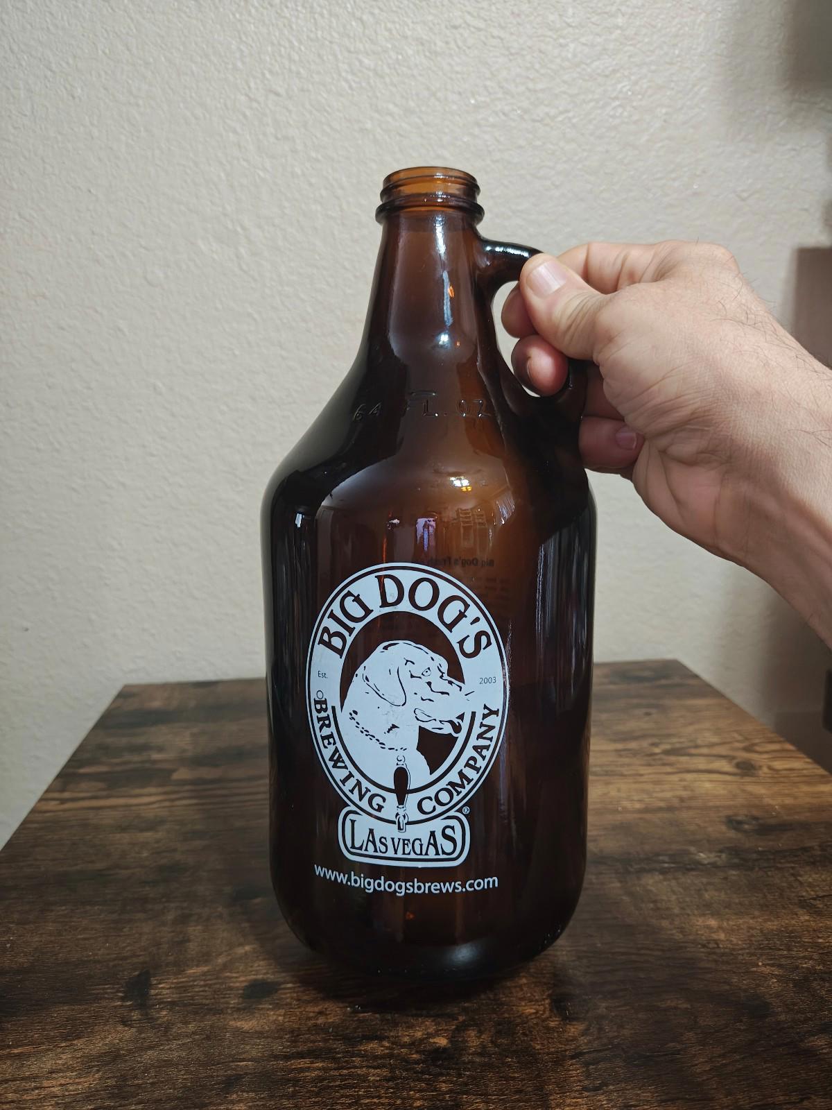 Amber glass jug with handle and Big Dog's Brewing Company Las Vegas logo