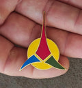 Klingon trefoil enamel pin badge with yellow, red, blue and green enamel and gold border