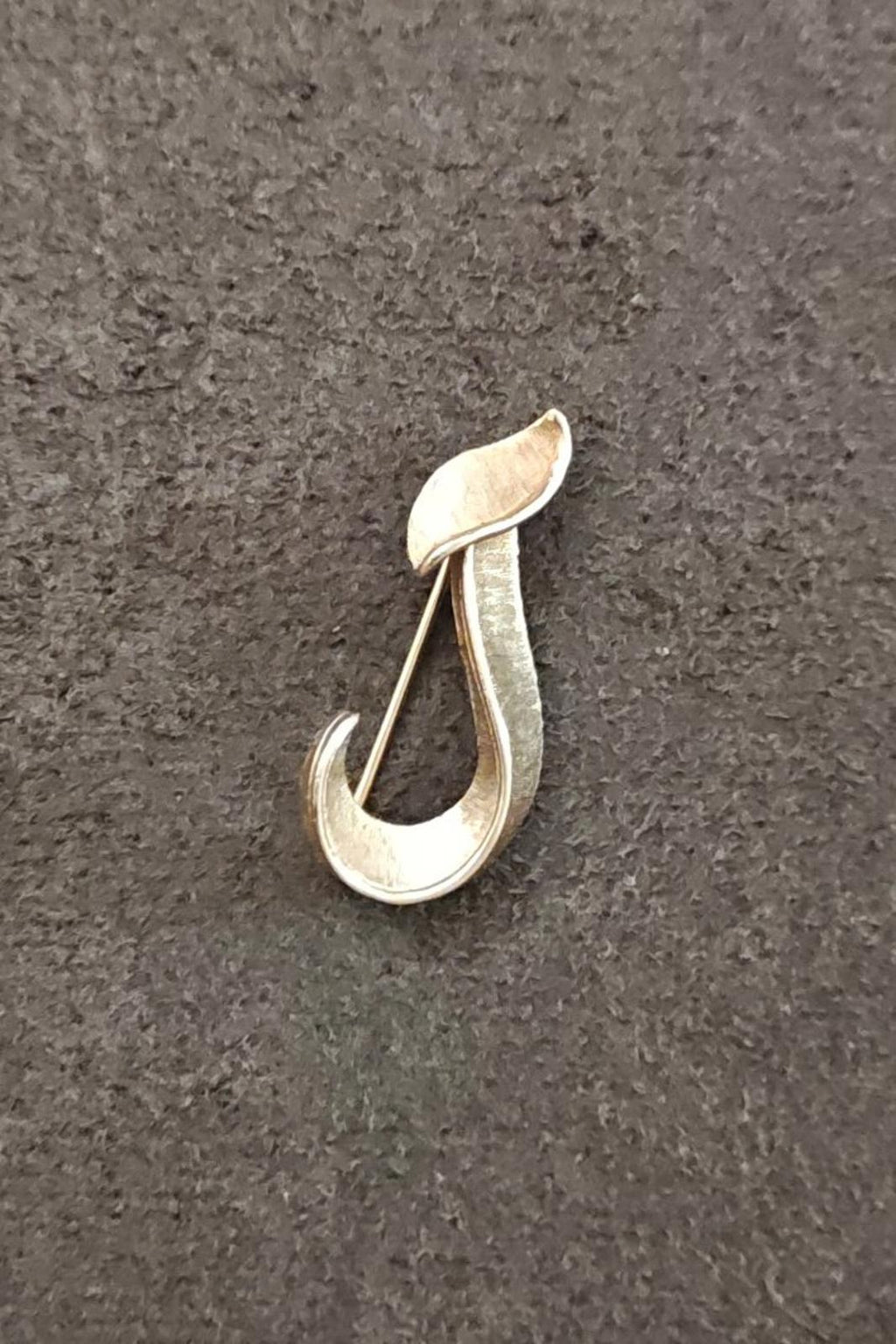 Gold-tone monogram J brooch with textured curved teardrop design