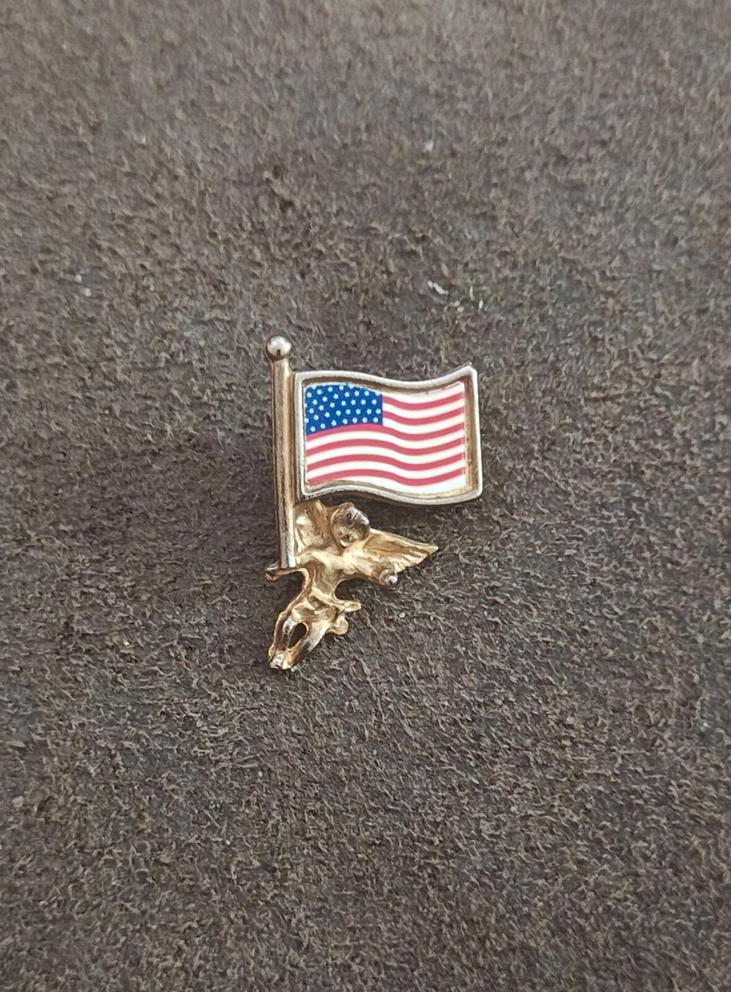 Gold-tone patriotic flag pin with cherub figure and raised flag enamel