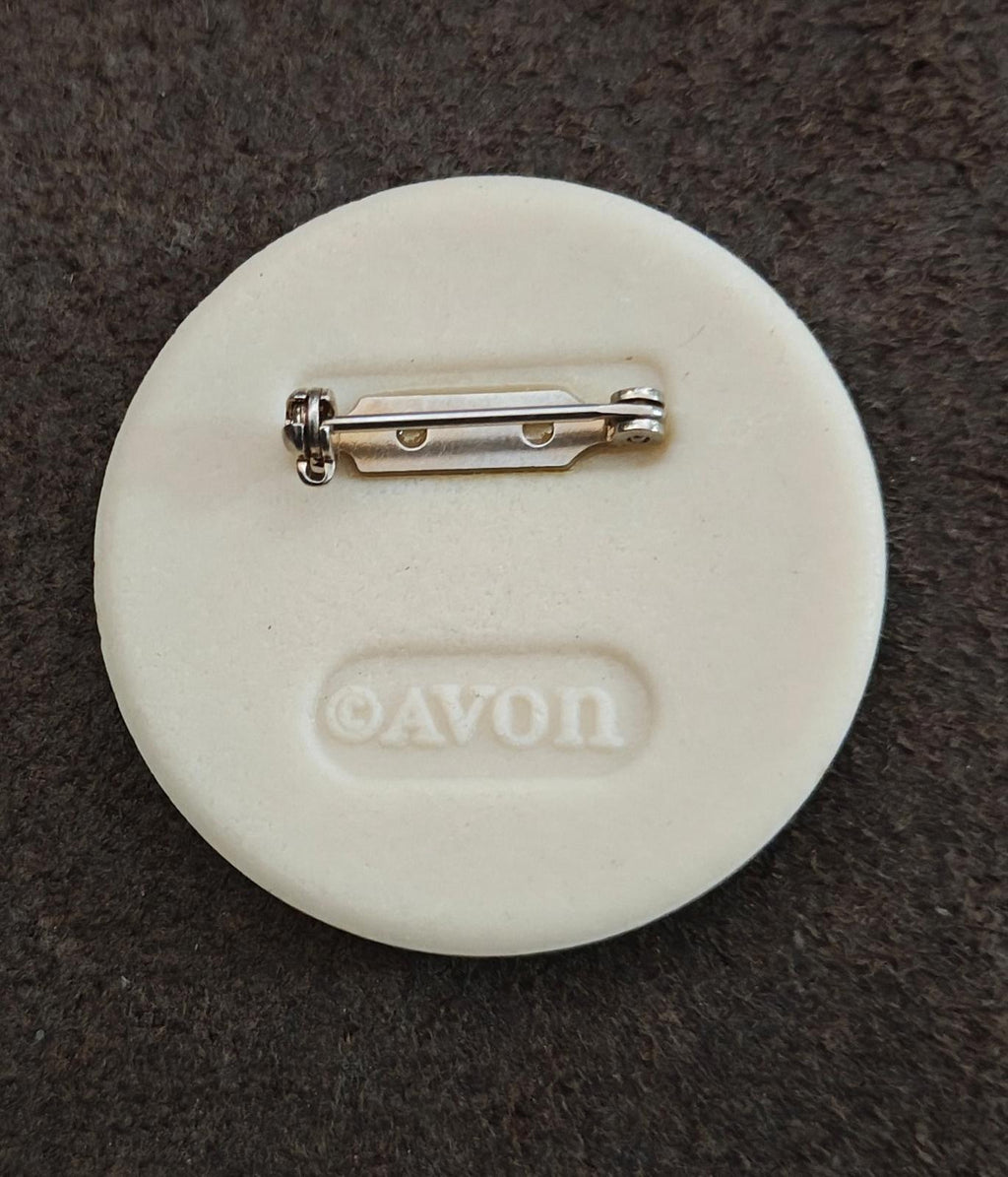Porcelain disc brooch pin back, white with silver clasp pin and AVON logo
