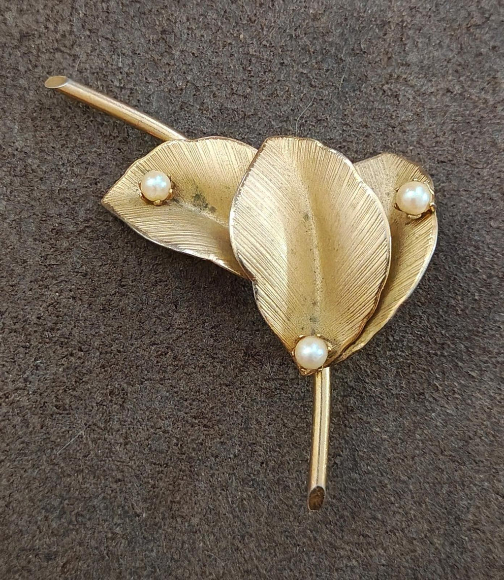 Gold textured leaf pin brooch with three faux pearls and a tapered back pin