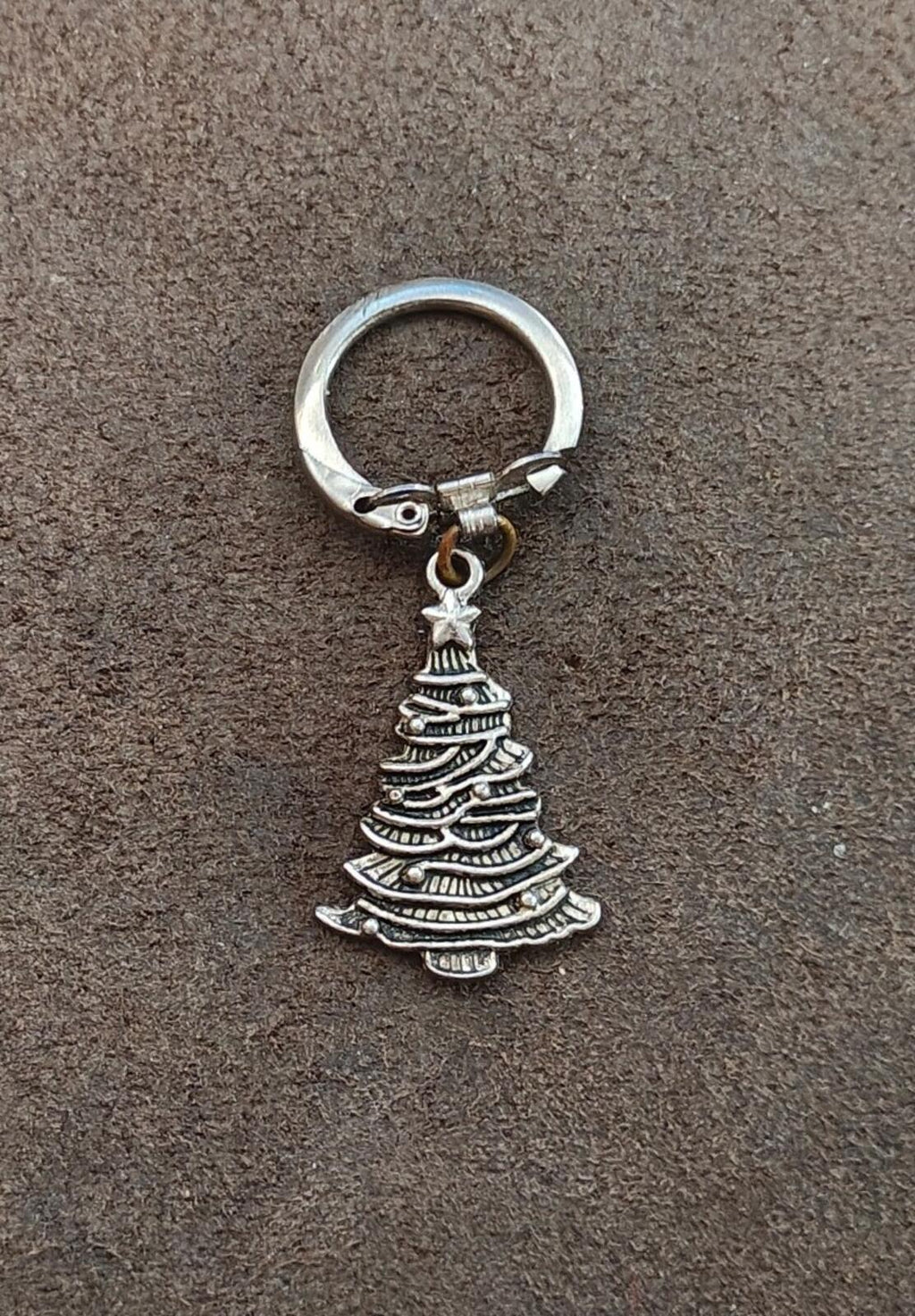Silver keychain with small Christmas tree charm pendant and round metal ring