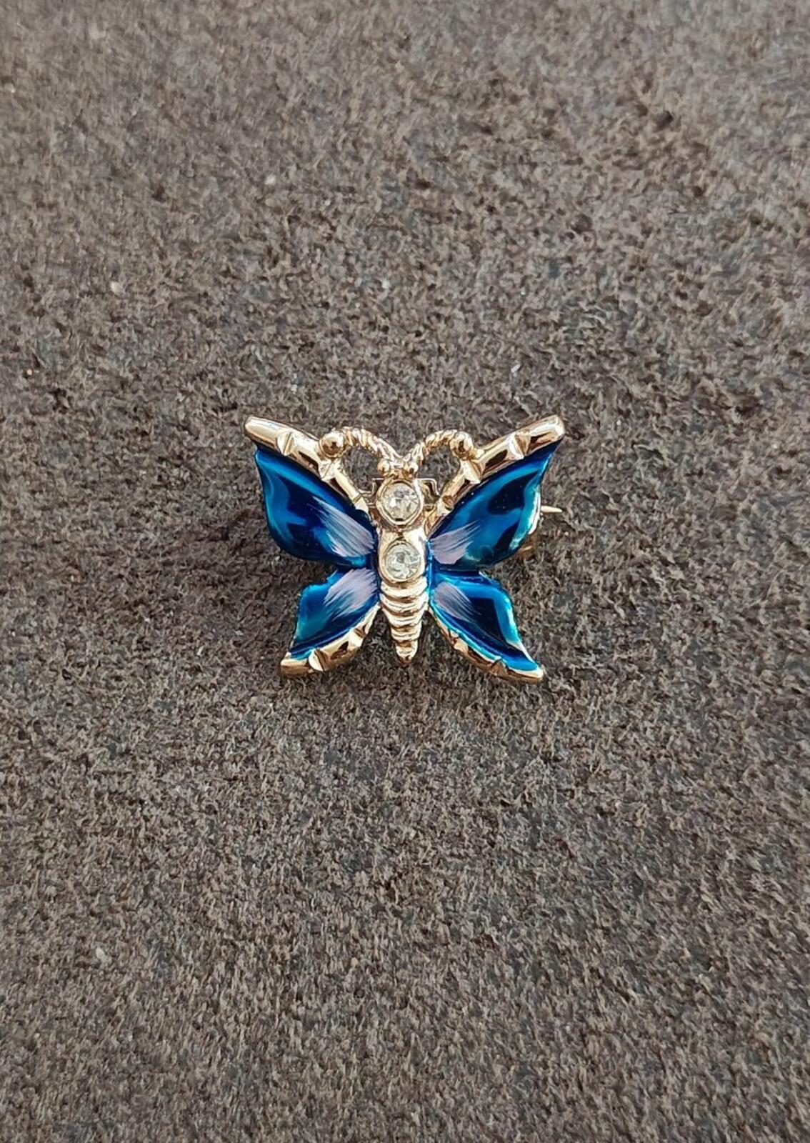 1980s Gold Tone Blue Enamel Butterfly Brooch Accented With Clear Rhinestones