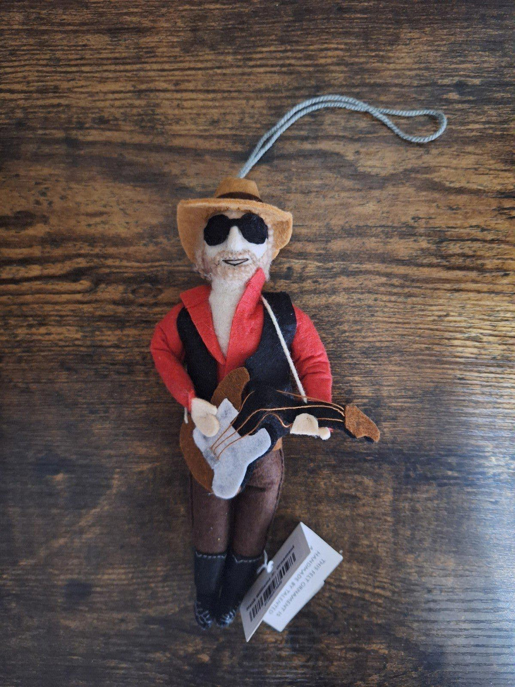 Felt and wool musician ornament front view with red jacket, hat, sunglasses, guitar, loop