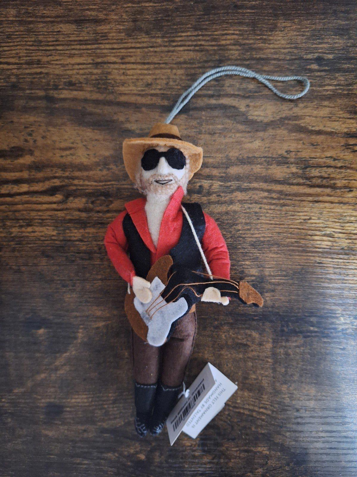 Felt and wool musician ornament front view with red jacket, hat, sunglasses, guitar, loop