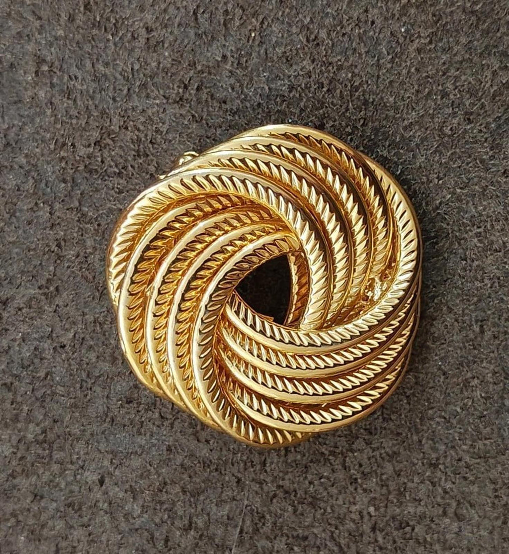 Gold tone circular rope swirl brooch pin with deep spiral cutout
