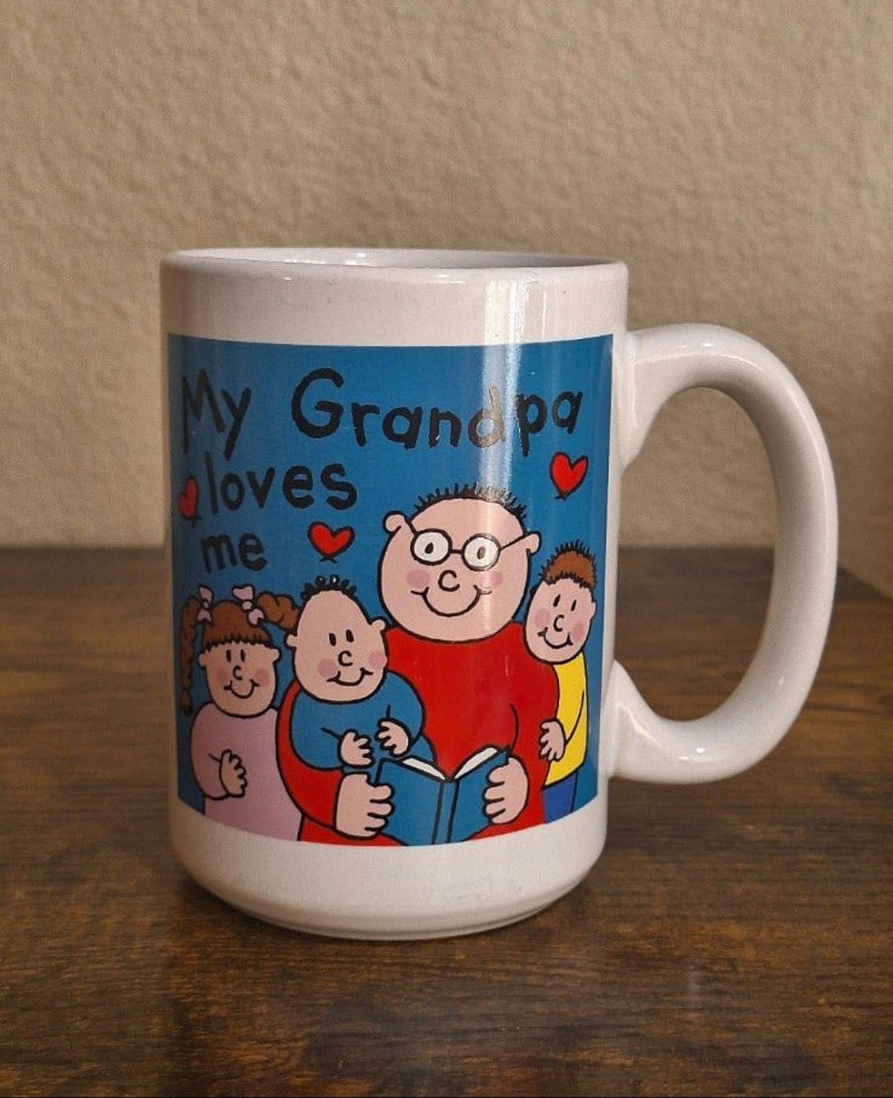 White ceramic mug front design with “My Grandpa loves me” text and smiling cartoon figures