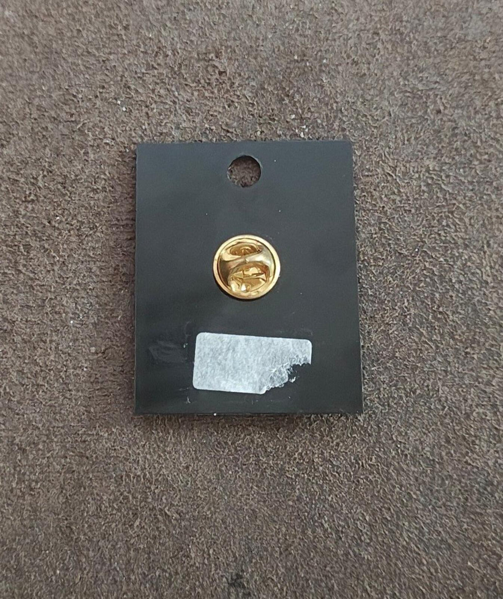 Gold tone enamel pin back with clasp, on black gift card