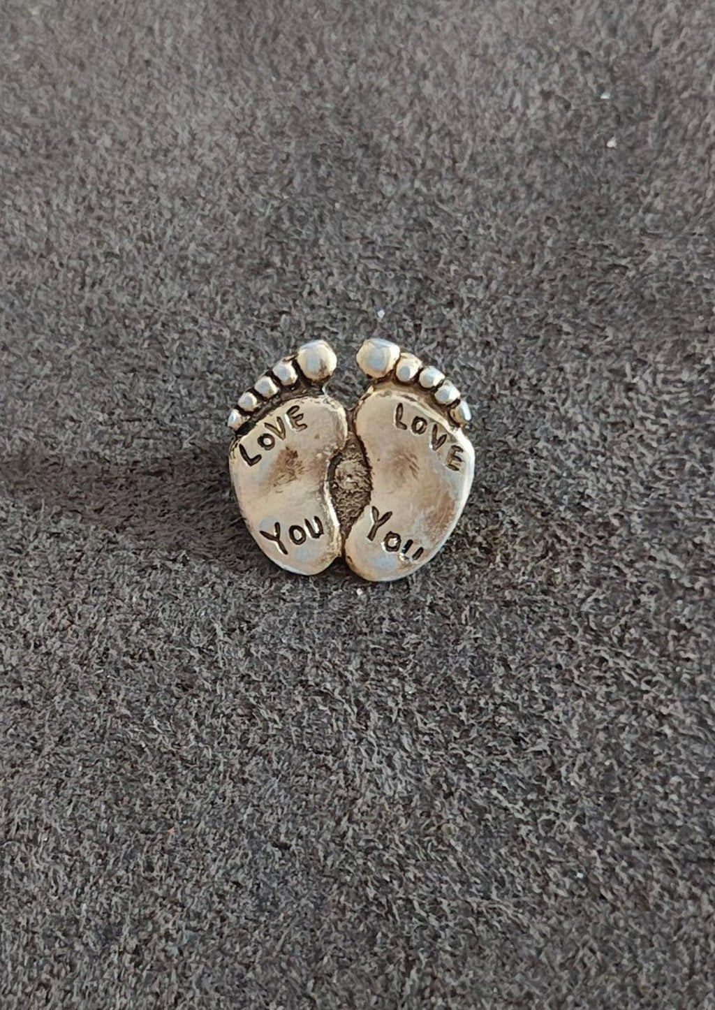 Gold-tone double footprint brooch pin with beaded edge and "LOVE YOU" lettering