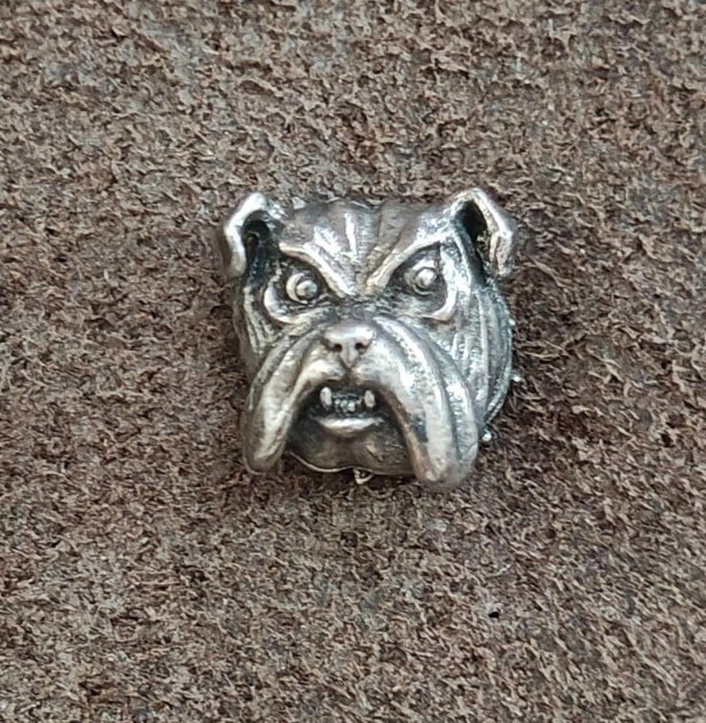 Front view of a silver-tone bulldog head pin with textured sculpting