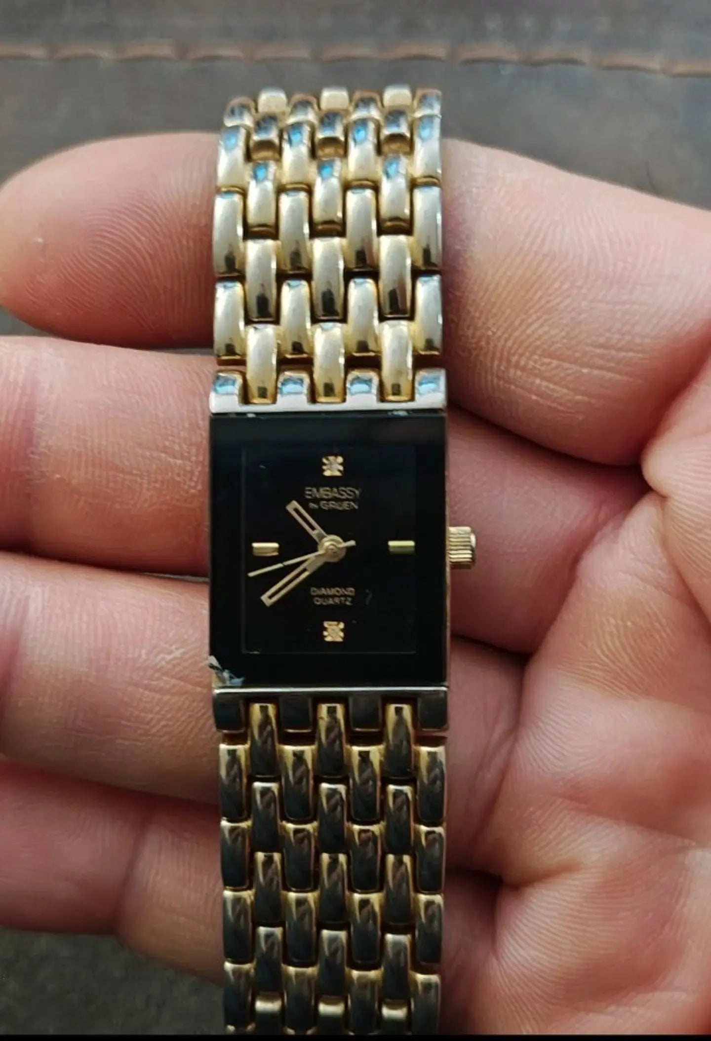 1990s Embassy by Gruen Gold Tone With Black Dial Ladies Diamond Accent Watch