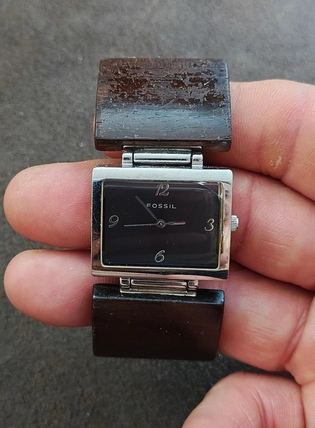 Ladies Fossil rectangular watch with dark dial, silver-tone case, brown wooden band